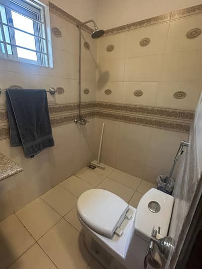 A beautiful house for rent in f10 ideal location All tile flooring near to market close to double road Big parking front beautiful lawn