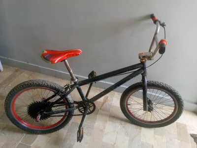 This is a original BMX bike with free footstands and a police light