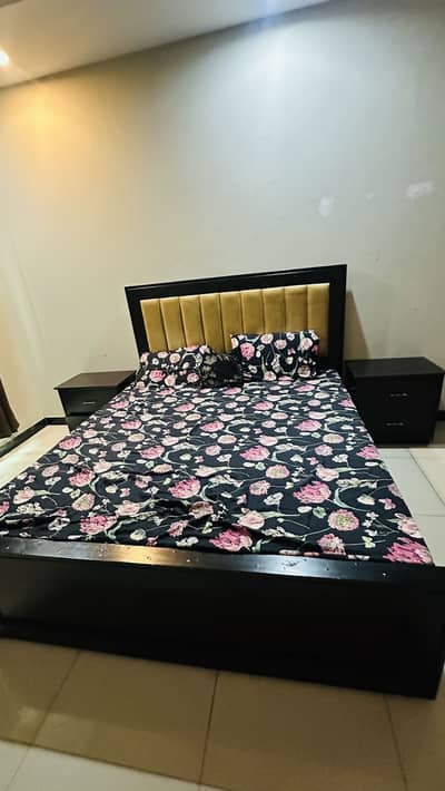 King bed with side table and curtains