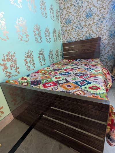 2 wooden single bed