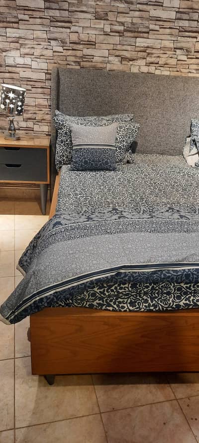 Wooden bed with two side table