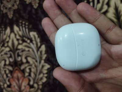 2 air buds and 1 mini power bank