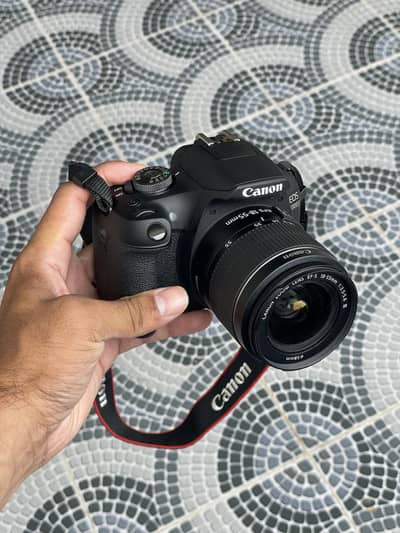 Canon EOS 2000D DSLR Camera with 18/55mm lens.