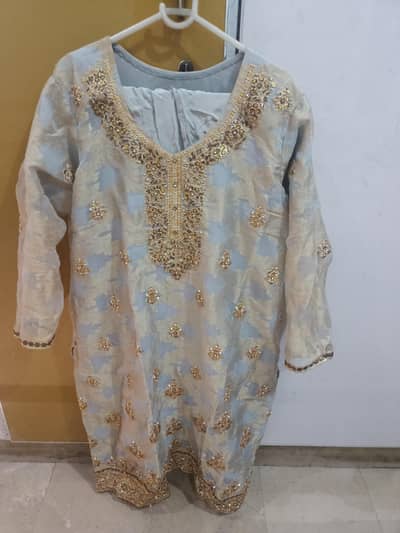 Powerder blue and gold embroidered suit with net dupatta