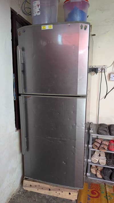 Silver Haier top-mount refrigerator.
