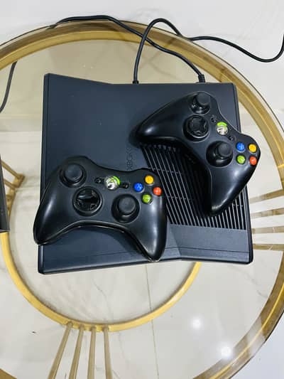Xbox 360 Slim with Original Supply and wireless controllers