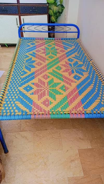 2 charpai and 1 wooden table