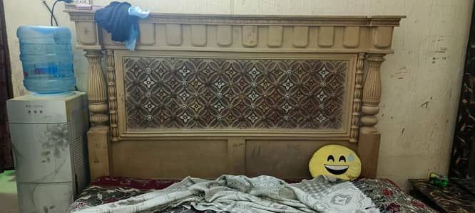 a good condition used wooden bed