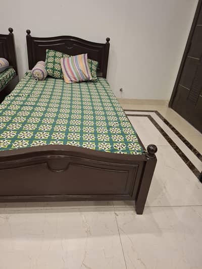 wooden single bed