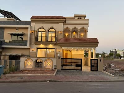 Brand new 10 marla luxury designer house avaliable for sale 5 bed accommodation 2 American kitchen 1 Servent two species TV lounge.  Available in Bahria Enclave Islamabad
