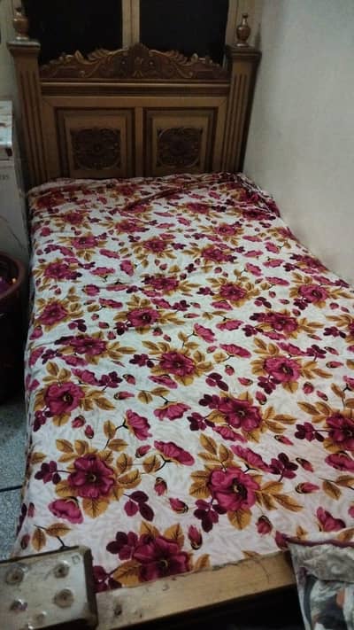 Solid wooden single bed with mettres for sale
