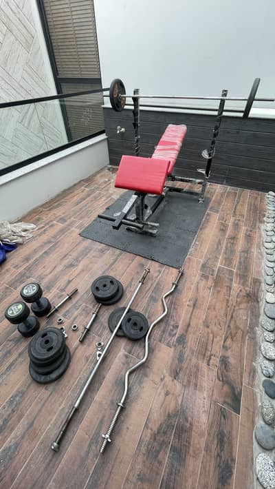 Multiple Exercise Gym Bench Press With Dumbells, rods, plates