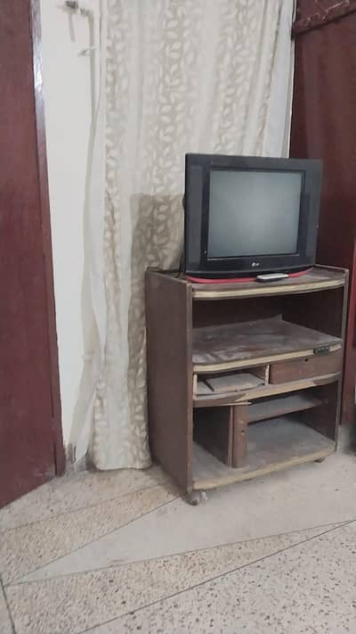Television and wooden trole table