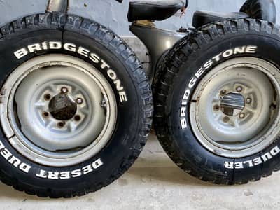 2 Bridgestone Desert Dueler 215R15 Tyres with 15” 6-Lug Steel Rims