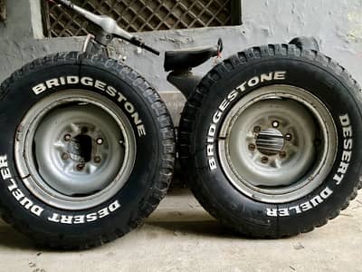 2 Bridgestone Desert Dueler 215R15 Tyres with 15” 6-Lug Steel Rims