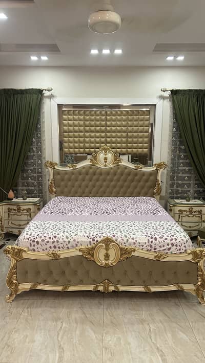 Royal bed with side tables with coffee table and chairs