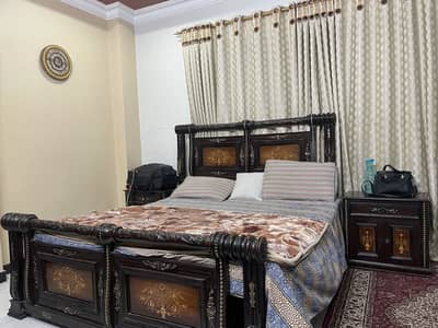 wooden double bed,sidetable,chairs,dressing