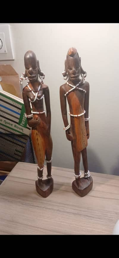 African Maasai couple figurines featuring intricuate detailed carving