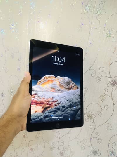 iPad Air 2. Storage 64 GB. Silver colour. Condition 10 by 9.