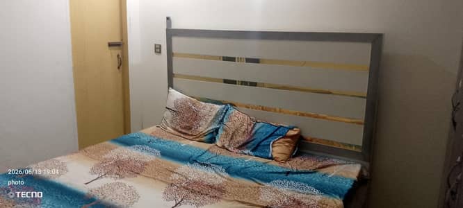 bed and dressing mirror