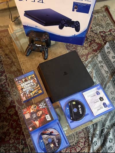 PS4 slim 500gb with box, 2 controllers and games