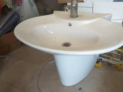 washroom basin with tap in used condition,