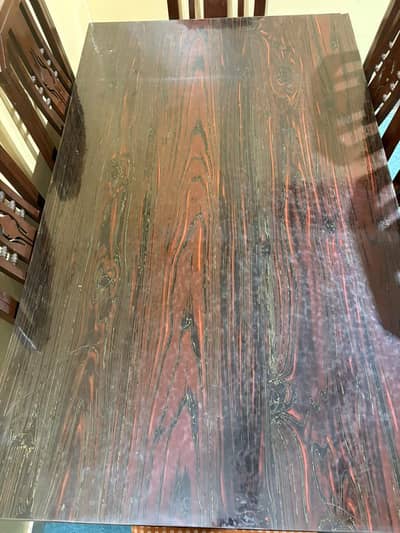 wooden dinning table along six Woden chairs