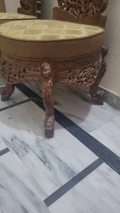 2 wooden chairs (stool)with a coffee table which mirror is cracked