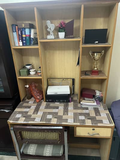 Study table with multiple shelves and chair