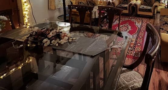 Dinning table with glass top and chairs