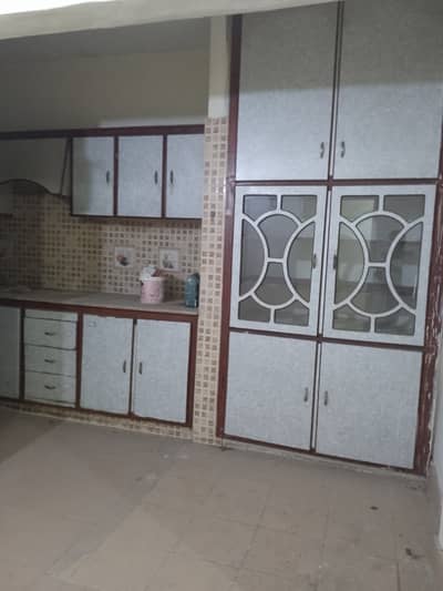 Renovated 2 bed dd ground floor maymar plaza flate for sale tiled flooring America kitchen tiled washrooms 24 hours water and electricity boundary wall project