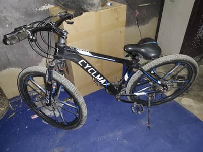 imported sports gear cycle with shocks and disk breaks