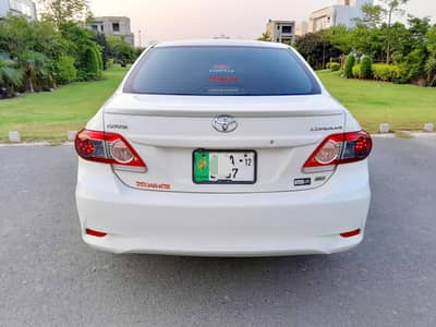 Bank Manager used Toyota Corolla XLI 2012 converted GLI  White Color