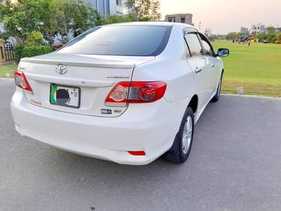 Bank Manager used Toyota Corolla XLI 2012 converted GLI  White Color