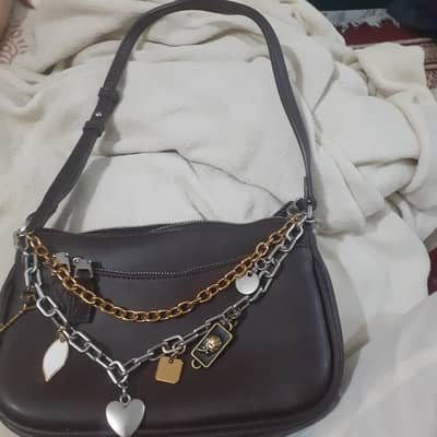 zara's mini bag with charms_brown