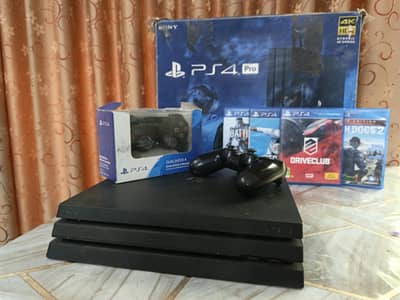 PS4 PRO 1TB WITH 2 CONTROLLERS AND 4 GAMES