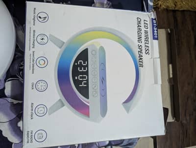 Wireless Chargingg + Bluetooth Speaker