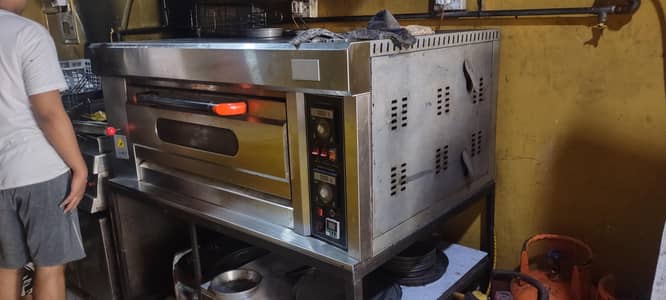 Pizza & and Burger items, deep freezer,Gas cylinders Equipment.