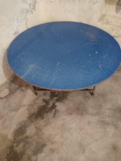 wooden round table with iron stand