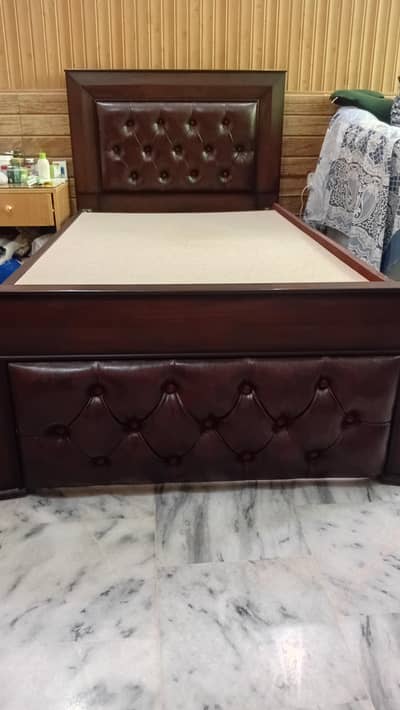 Wooden single bed.