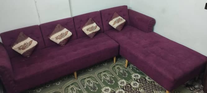 magenta/wine colored L shaped sofa
