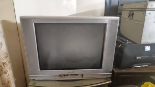 retro classic crt TV. with silver trolley.