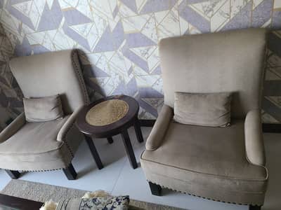 pair of single sofas and center table