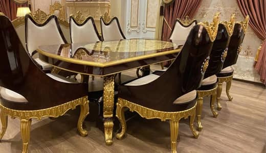 Dining table with 8 chairs. No stretch. Less used. Black and golden.