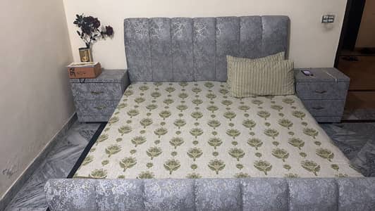 Bed with side table