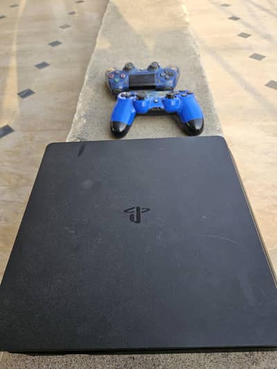Playstation 4 Slim 1TB 10/10 with 2 controllers