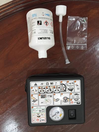 Suzuki original tyre mobility kit, electric air compressor & punc kit