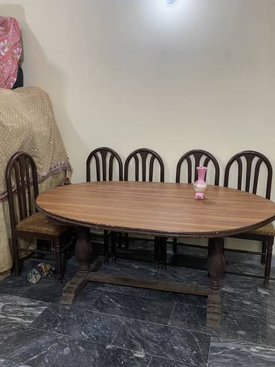 Dining table with 5 chairs in good condition with separate showcase