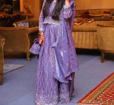 Elegant Lavender Lehnga with Heavy Embroidery. One time used