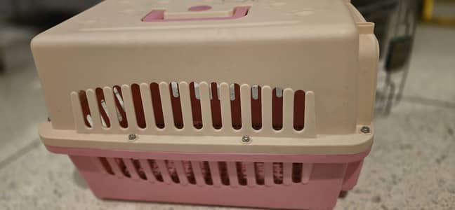 cat carrier in pink  colour